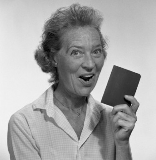 Studio portrait of senior woman holding passport Poster Print - Item # VARSAL255417901