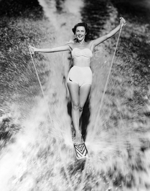 1950s Smiling Woman In White Two Piece Bathing Suit Aquaplaning Water Skiing Looking At Camera Print By Vintage - Item # PPI176460LARGE