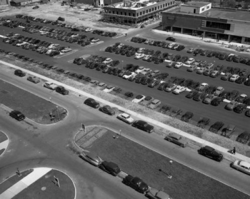 Elevated view of cars on street and parking lot by supermarket Poster Print - Item # VARSAL255417837