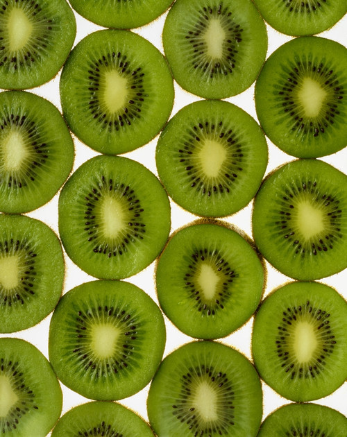 Agriculture - Kiwi slices arranged in rows and backlit, studio. Version 2. PosterPrint - Item # VARDPI2343490