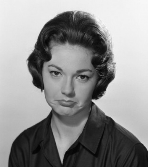 Portrait of young woman making sad face  studio shot Poster Print - Item # VARSAL255417359