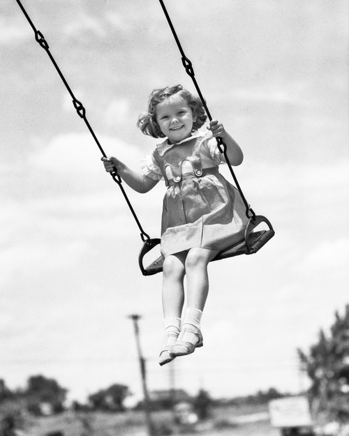 1930s-1940s Smiling Girl On Swing Outdoor Looking At Camera Poster Print By Vintage Collection (22 X 28) - Item # PPI177427LARGE