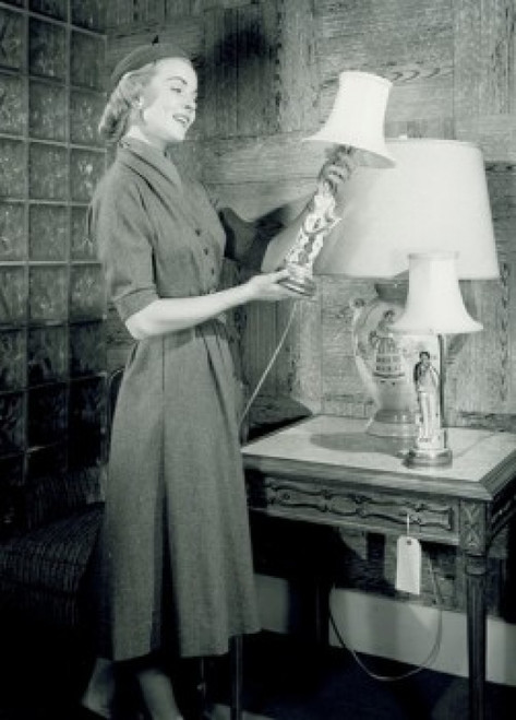 Woman watching lamp in shop Poster Print - Item # VARSAL255418642