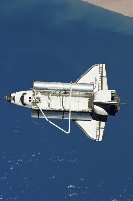 March 7, 2011 - The space shuttle Discovery as seen from the International Space Station. The area below is in the northern Atlantic Poster Print - Item # VARPSTSTK203650S