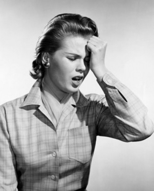 Young woman suffering from a headache Poster Print - Item # VARSAL25534862