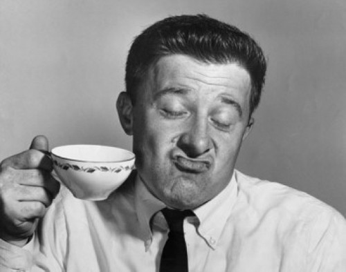 Mature man holding tea cup and making a face Poster Print - Item # VARSAL2554250