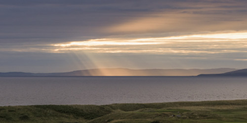 Sunlight shining through clouds onto the coastline; Turnery, Scotland PosterPrint - Item # VARDPI12302862