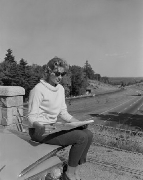 Woman sitting on rear of car  studying map Poster Print - Item # VARSAL255416351 Woman sitting on rear of car  studying map Poster Print - Item # VARSAL255416351