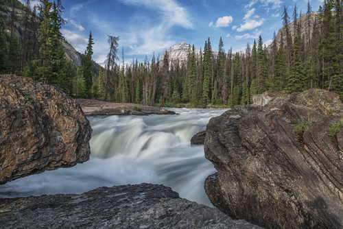 The Kicking Horse River flows over a waterfall before it goes beneath a natural bridge, Yoho National Park; British Columbia, Canada PosterPrint - Item # VARDPI12252422