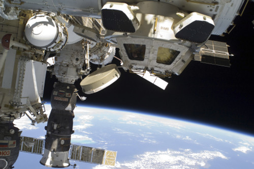 March 2, 2011 - The Cupola of the International Space Station and a docked Russian Progress spacecraft, backdropped by Earth's horizon and the blackness of space. Poster Print - Item # VARPSTSTK203648S
