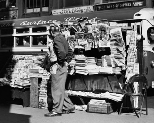 Side profile of a vendor standing in front of his news stand  New York City  USA Poster Print - Item # VARSAL25539072