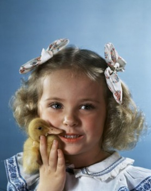 Close-up of a girl holding a duckling and looking afraid Poster Print - Item # VARSAL9661655