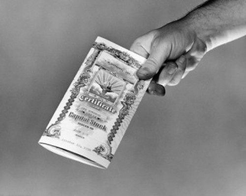 Close-up of person's hand holding a stock certificate Poster Print - Item # VARSAL25526167