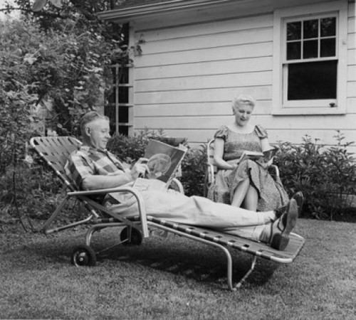 Senior couple reading books in the backyard Poster Print - Item # VARSAL25548929