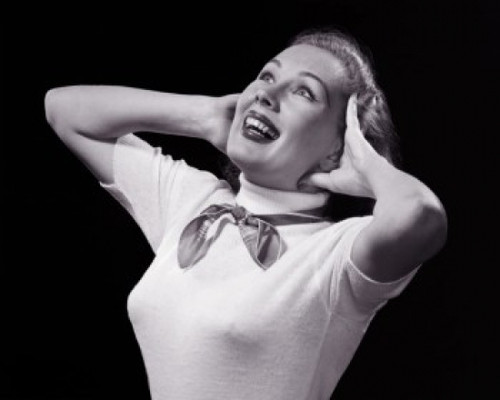 Close-up of a young woman smiling with her head in her hands Poster Print - Item # VARSAL25510878