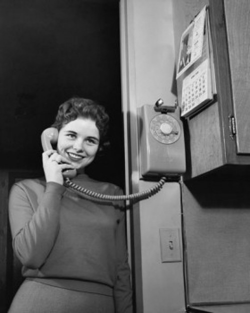 Low angle view of a teenage girl talking on the telephone Poster Print - Item # VARSAL2554755