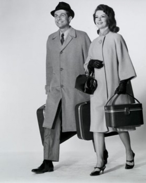 Mid adult couple walking with luggage Poster Print - Item # VARSAL25544352