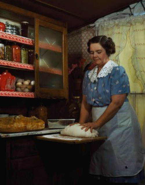 Mature woman kneading dough in a domestic kitchen Poster Print - Item # VARSAL34562440