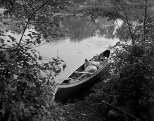 Woman relaxing in canoe Poster Print - Item # VARSAL255422724