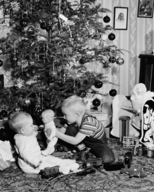 Side profile of a boy and his sister playing with a toy Poster Print - Item # VARSAL2554490