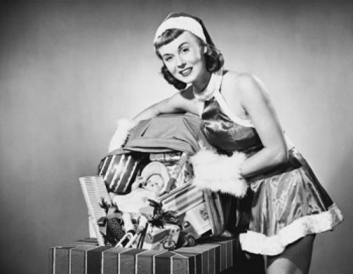 Portrait of a young woman holding a sack of Christmas presents Poster Print - Item # VARSAL25522514C