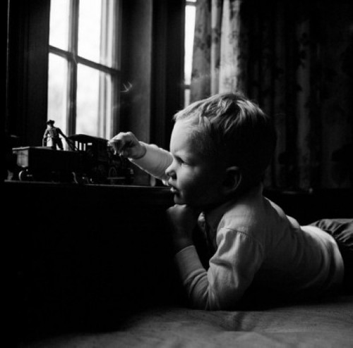 Boy playing with toy train Poster Print - Item # VARSAL255416968