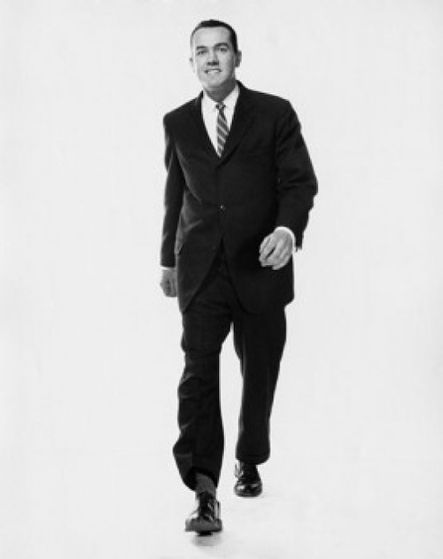 Studio portrait of businessman walking Poster Print - Item # VARSAL25548158