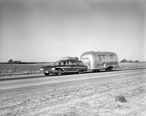 1960s-1970s Family Station Wagon And Camping Trailer Driving On Country Highway On Vacation Print By Vintage Collection - Item # PPI194344LARGE