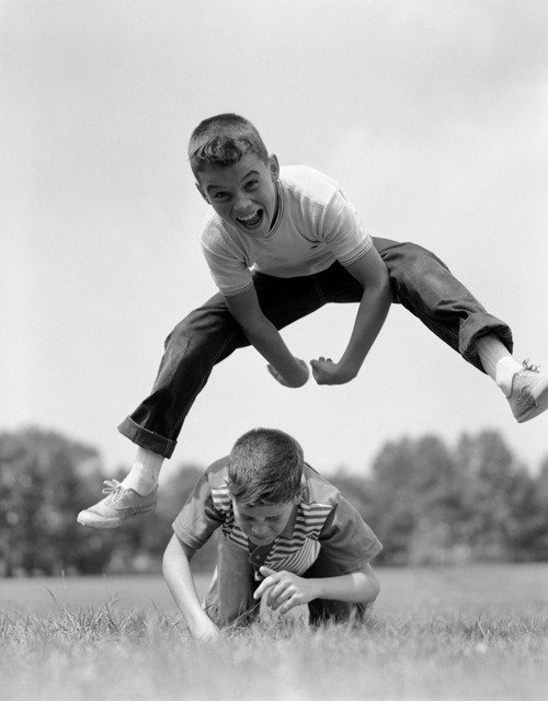 1960s Boys Playing Leap Frog Outside Sky Grass Jump Jumping Crouching Poster Print By Vintage Collection (22 X 28) - Item # PPI177770LARGE