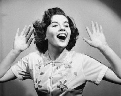 Close-up of a young woman with her arms raised and laughing Poster Print - Item # VARSAL25550134