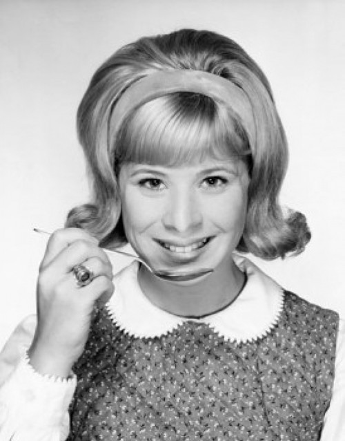 Portrait of a young woman holding a spoon and smiling Poster Print - Item # VARSAL25517041C