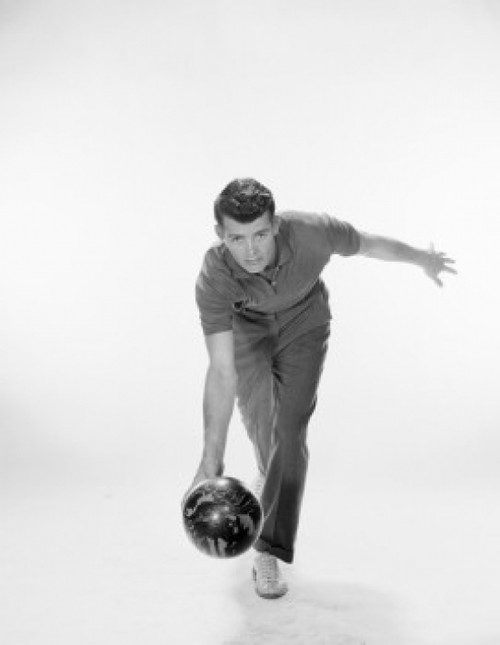 Young man rolling a bowling ball Poster Print - Item # VARSAL2558881B