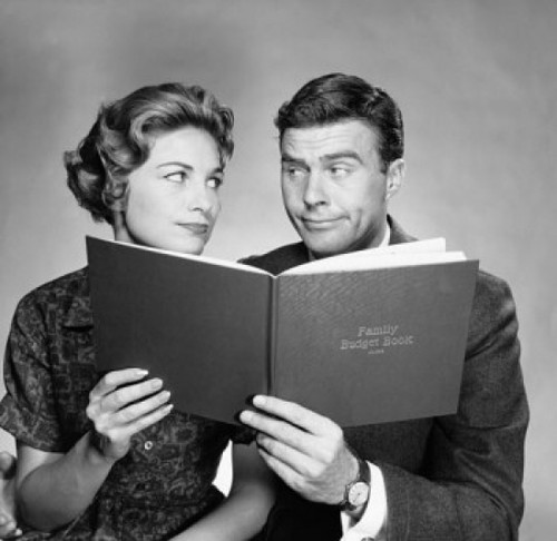 Close-up of a mid adult couple holding a family budget book Poster Print - Item # VARSAL25512567B