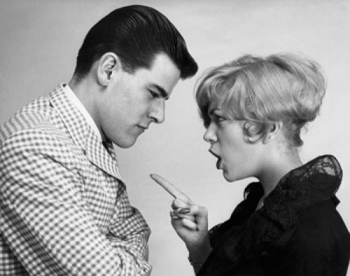 Side profile of a young woman shouting at a young man Poster Print