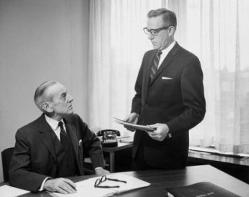 Two businessmen talking in office Poster Print - Item # VARSAL25547996