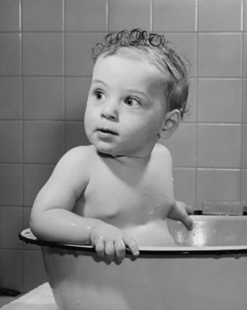 Baby in a bathtub Poster Print