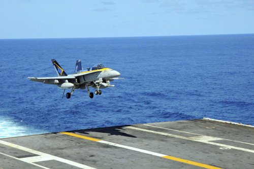 Pacific Ocean, October 20, 2011 - An F/A-18C Hornet lands aboard the aircraft carrier USS Ronald Reagan Poster Print - Item # VARPSTSTK104928M
