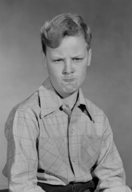 Portrait of boy making faces Poster Print