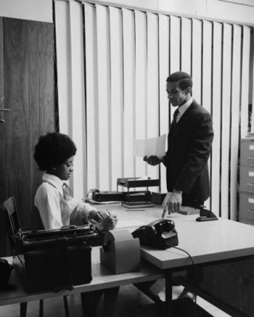 Side profile of businessman dictating letter to his secretary Poster Print - Item # VARSAL25548507