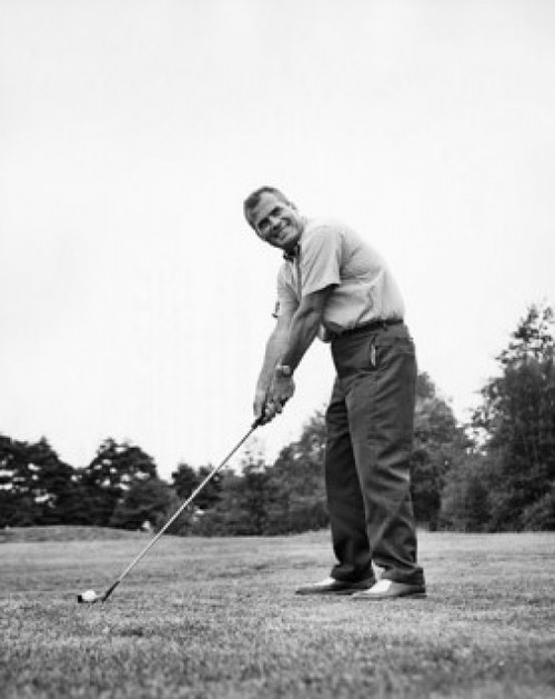 Mature man playing golf on a golf course Poster Print - Item # VARSAL25518954