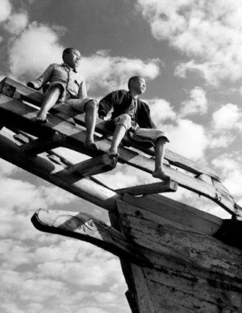 Boys sitting on top of boat Poster Print - Item # VARSAL25547947