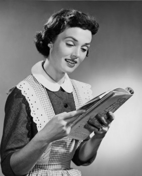 Young woman reading magazine Poster Print - Item # VARSAL25542029