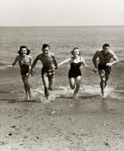 Two young couples running on the beach Poster Print - Item # VARSAL2552987