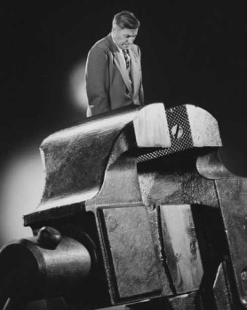 Side profile of a businessman standing in a vise grip Poster Print - Item # VARSAL2553131A