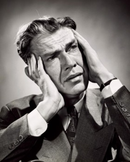 Close-up of a businessman suffering from a headache Poster Print