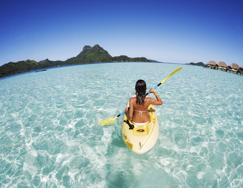 French Polynesia, Bora Bora, Female Kayaker Enjoying A Day On The Water. PosterPrint - Item # VARDPI1975962