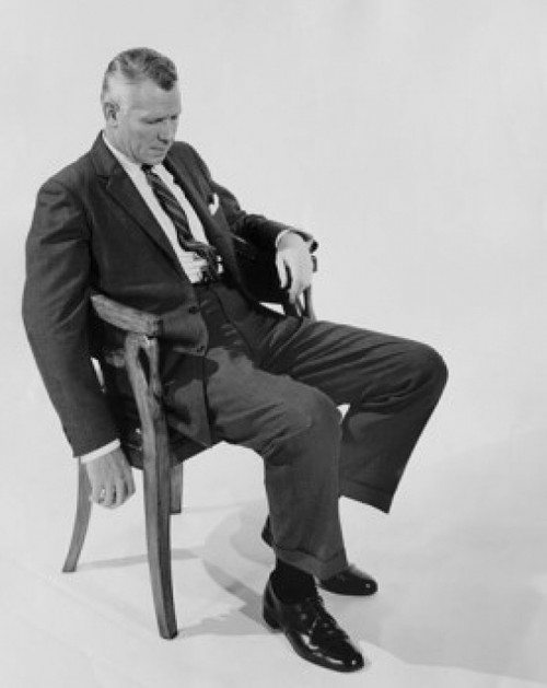 Businessman sitting on a chair Poster Print - Item # VARSAL25534776