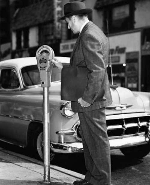 Mid adult man using a parking meter Poster Print - Item # VARSAL25526570