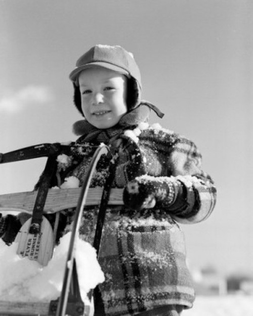 Portrait of boy covered with snow  holding sleigh Poster Print - Item # VARSAL255416320