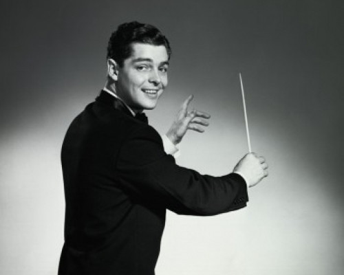 Portrait of a music conductor holding a conductor's baton Poster Print - Item # VARSAL2553357